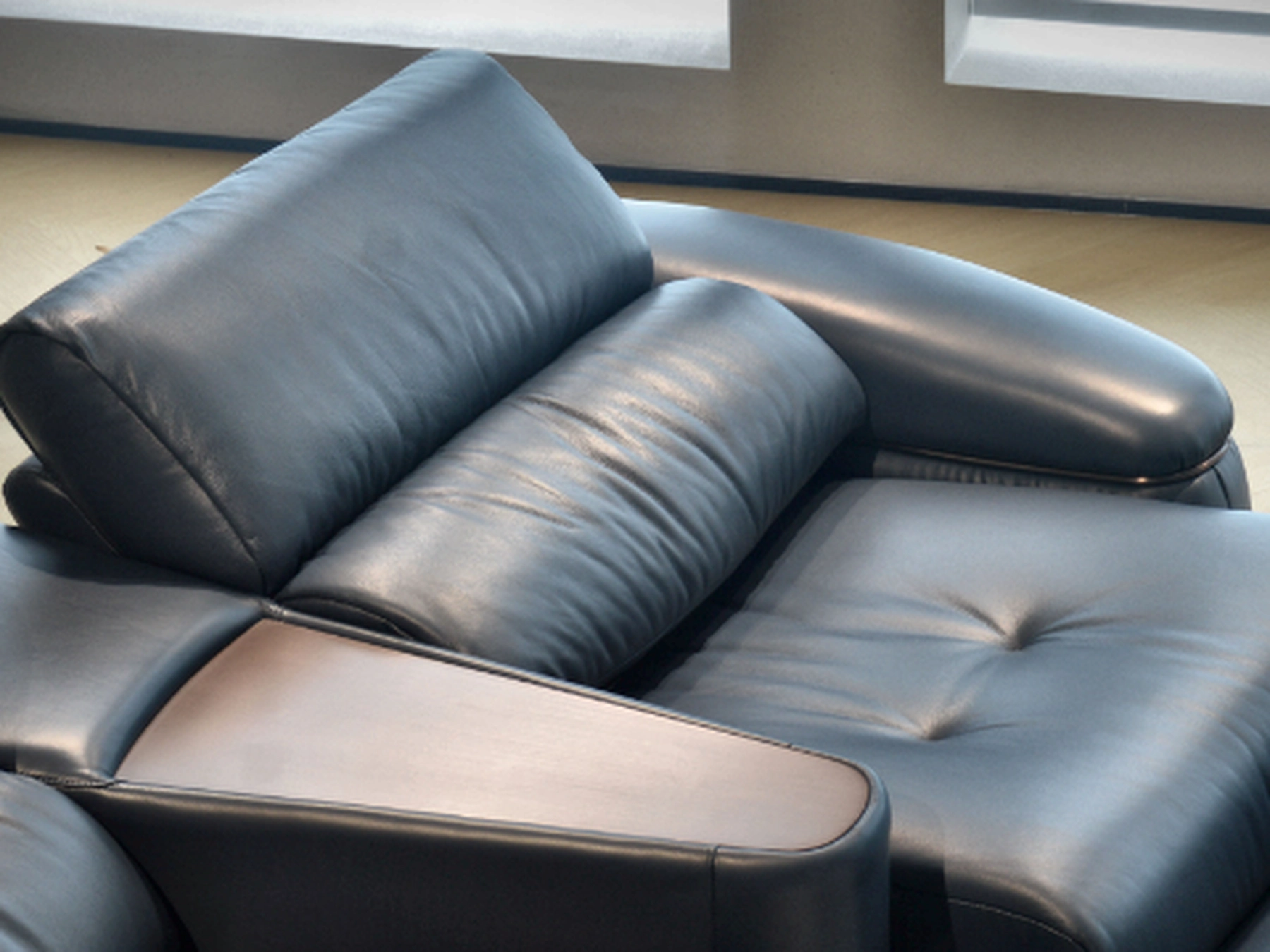 Grand Row upholstered backrest and leather detail